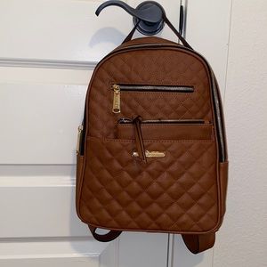 Brown backpack with matching wallet
